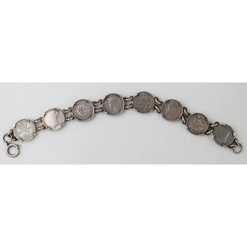 562 - A silver bracelet hallmarked Birmingham set with a collection of silver Threpenny bit coins, all pre... 