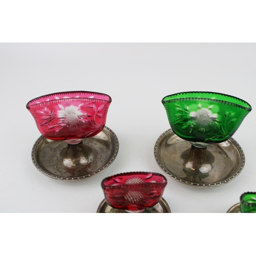 571 - A set of four silver and coloured glass table settings, marked Asprey, two graduated pairs, hallmark... 