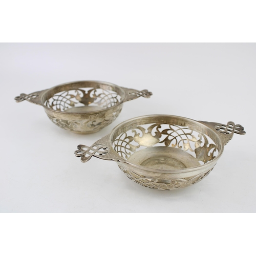 573 - A pair of silver sweet dishes, in the form of a quaich, 313.8g, Sheffield 1908, 19cm wide.