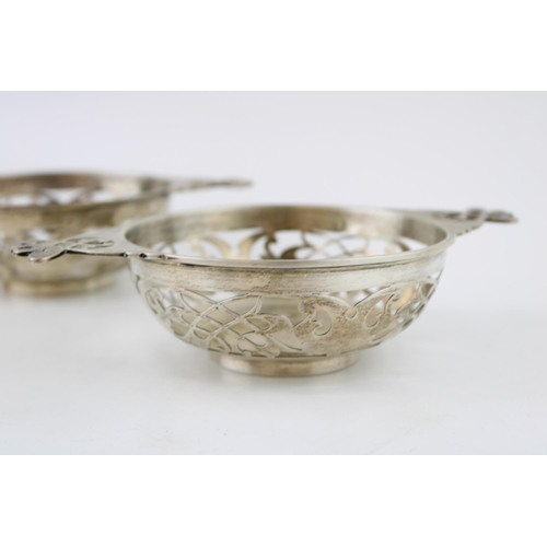 573 - A pair of silver sweet dishes, in the form of a quaich, 313.8g, Sheffield 1908, 19cm wide.