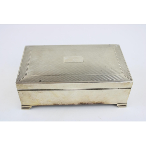 576 - Large silver cigarette box, engineered decoration, vacant cartouche, wooden interior, Birmingham 195... 