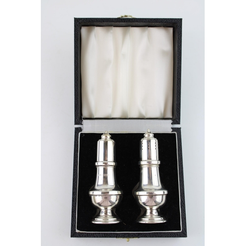 577 - A pair of silver cruets, Birmingham 1982, associated box, 68.3g.