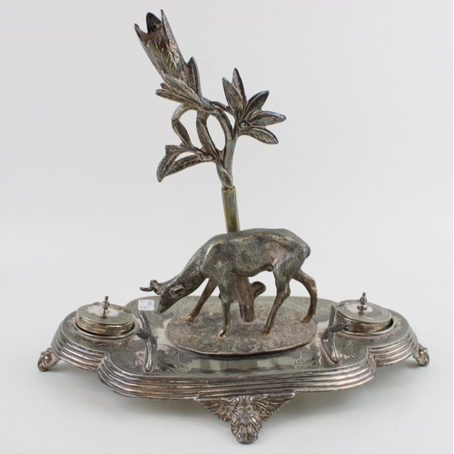 581 - Silver plated ink stand, Indian influenced design with deer standing under palm tree. Height 25cm.