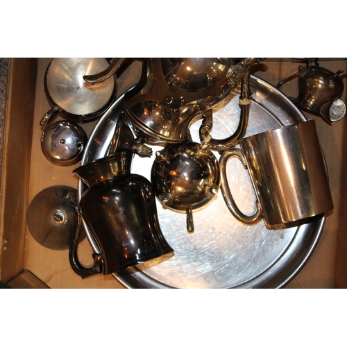 588 - A collection of silver-plated items to include tray, tea pot, tankards, cigarette boxes, bowls and o... 