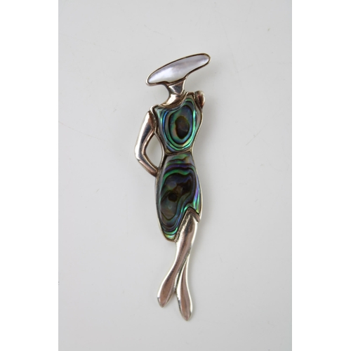 589 - Contemporary sterling silver pendant in the form of a lady, set abalone, 6.5cm tall.