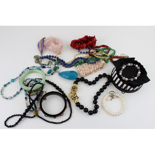 619 - Costume jewellery to include necklaces, a jaguar style bracelet, bangles and others (Qty).