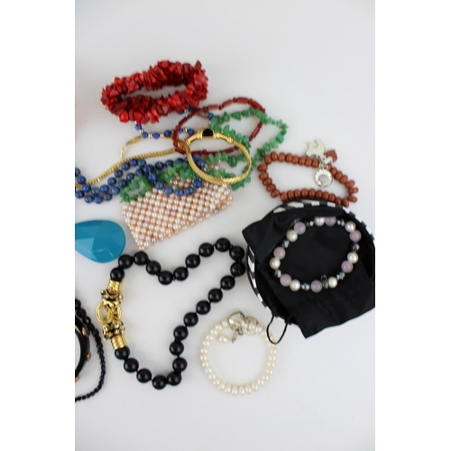 619 - Costume jewellery to include necklaces, a jaguar style bracelet, bangles and others (Qty).