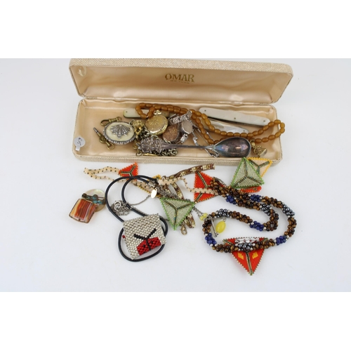 621 - Costume jewellery to include gilt metal lockets, metal albert chains, a watch key and others (Qty).