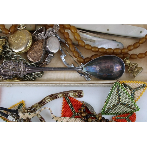 621 - Costume jewellery to include gilt metal lockets, metal albert chains, a watch key and others (Qty).