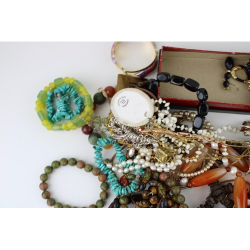 622 - Costume jewellery to include odd silver rings, necklaces, bangles, a compact and others.