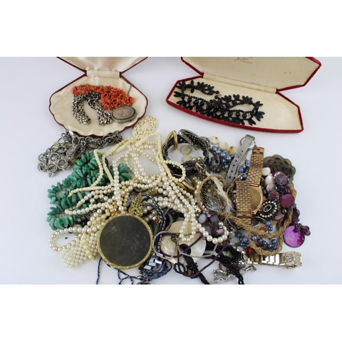 624 - Costume jewellery to include necklaces, a silver plated bird locket with necklace, a hand mirror, fa... 