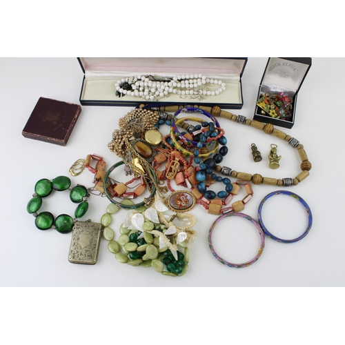 627 - Costume jewellery to include necklaces, gold on silver earrings, a brass imp, a plated vesta case an... 