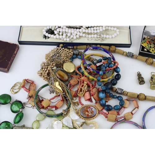 627 - Costume jewellery to include necklaces, gold on silver earrings, a brass imp, a plated vesta case an... 