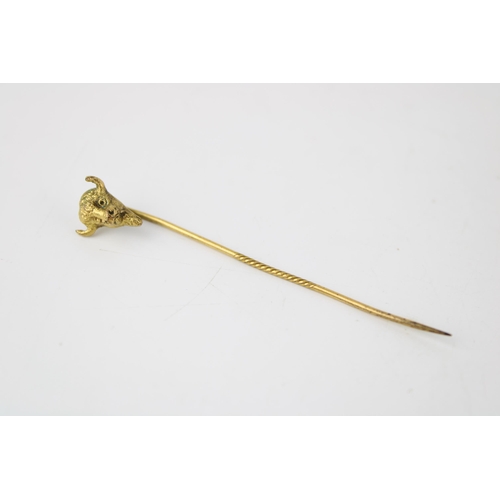 632 - Edwardian gold plated stick pin in the form of a buffalo's head, possibly masonic, 6.5cm long.