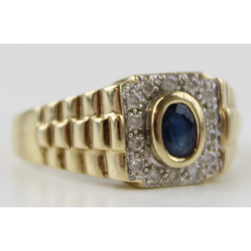 635 - A vintage gents 9ct gold ring set diamonds and sapphire. Ring size Z. Weight 6.3g.