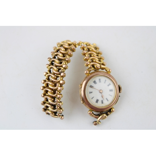 644 - 9ct gold lady's wristwatch on 9ct gold expanding strap, working movement, strap af, gross 26.2g.