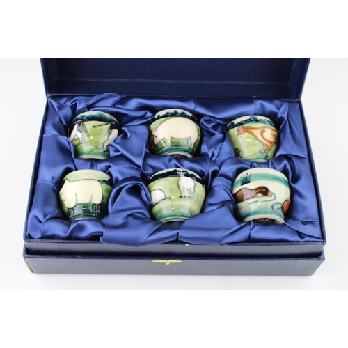 71 - Boxed Moorcroft 'Farmyard' egg cups set of six, designed by Angela Davenport.