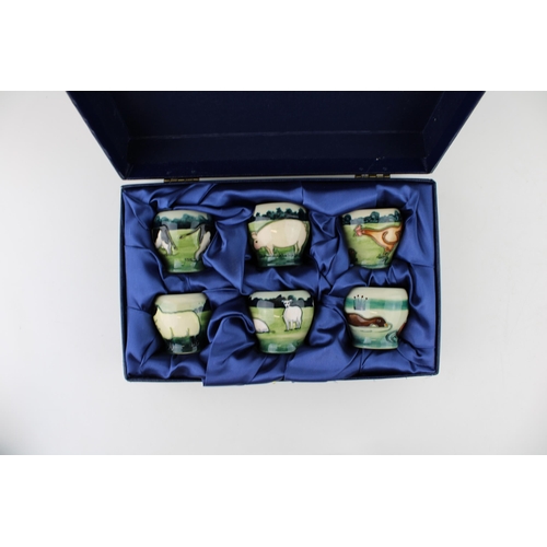 71 - Boxed Moorcroft 'Farmyard' egg cups set of six, designed by Angela Davenport.