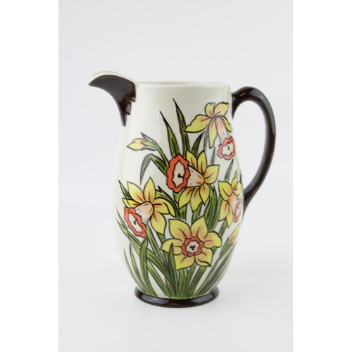 83 - A Oldcourt Ware jug by Lorna Bailey, Daffodils design, height 21cm.