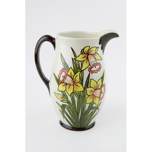 83 - A Oldcourt Ware jug by Lorna Bailey, Daffodils design, height 21cm.