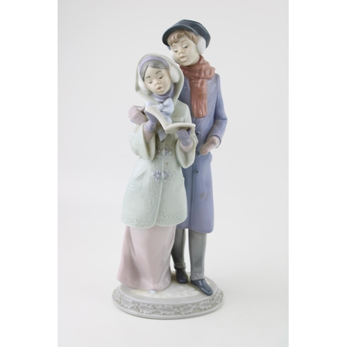 95 - Lladro figural group 6128 ‘Christmas Melodies’, 27.5cm tall.