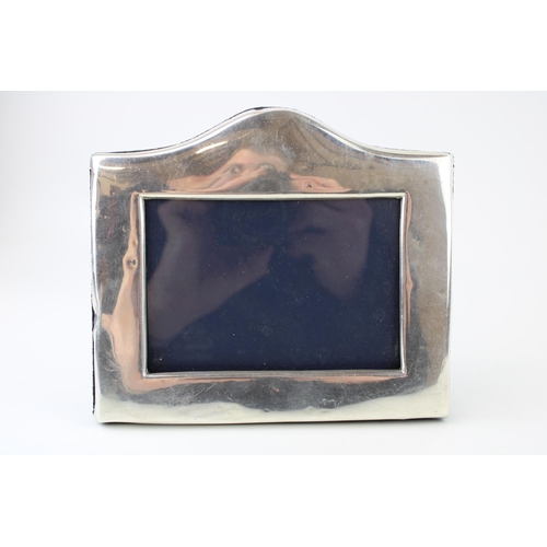 595 - Hallmarked silver photo frame, 18cm wide.