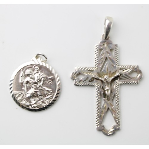 597 - A silver crucifix pendant with a St Christopher, 20.0g (2).