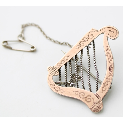 600 - Gold on silver brooch in the form of a harp / lyre, 5g.