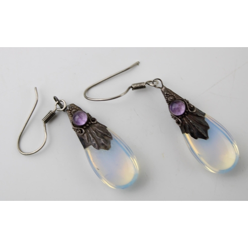 603 - A pair of silver and moonstone earrings (2).