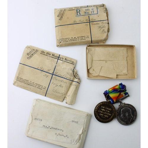 610 - World War One pair of medals to PTE F MOULSON W YORK REGIMENT, with paperwork and envelope.