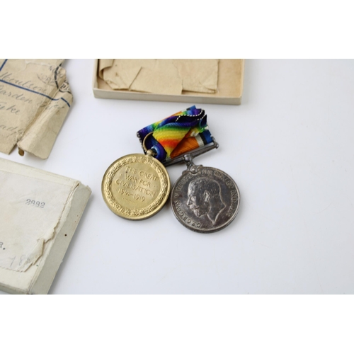 610 - World War One pair of medals to PTE F MOULSON W YORK REGIMENT, with paperwork and envelope.