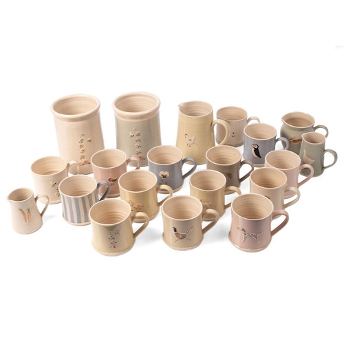 228 - A large collection of Jane Hogben Pottery in floral and animal patterns to include 14 mugs,2 pots, 3... 