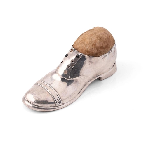 273 - Large hallmarked silver novelty pin cushion in the form of a shoe, Birmingham 1909, 12.5cm long.