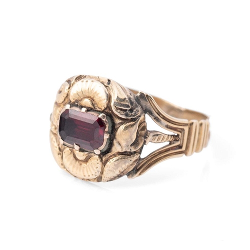 345 - A 19th century mourning ring, tests as 9ct gold or better, inset with a garnet and monogram engraved... 