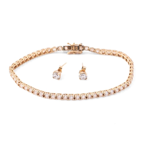 384 - 14ct gold tennis bracelet, matching earrings, set cubic zirconias, total 8.9g, bracelet 19cm long.