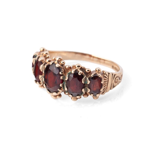 388 - 9ct gold garnet five stone ring, size O, 3.7g.