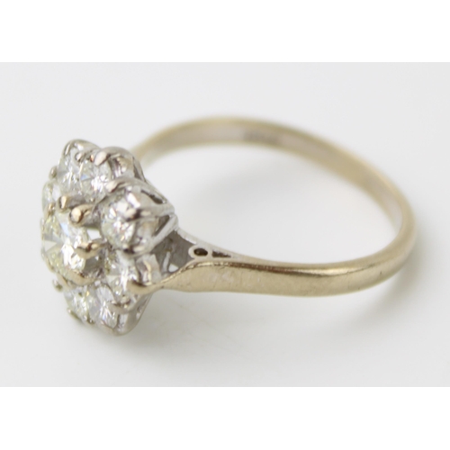 316 - Diamond cluster ring, claw set central round-cut brilliant diamond, within border of eight further d... 