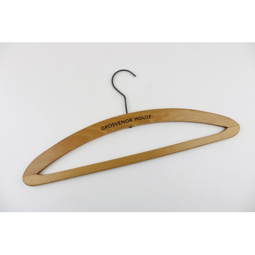 12 - A vintage coat hanger 'GROSVENOR HOUSE.' Width 43cm.