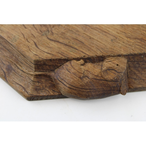 122 - Robert 'Mouseman' Thompson bread board, carved mouse to side, 30.5cm x 26cm.