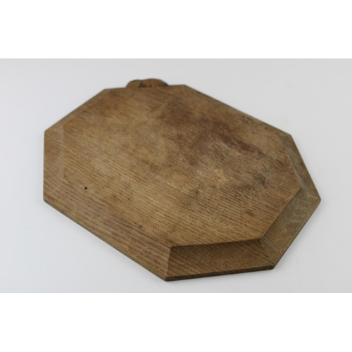 122 - Robert 'Mouseman' Thompson bread board, carved mouse to side, 30.5cm x 26cm.