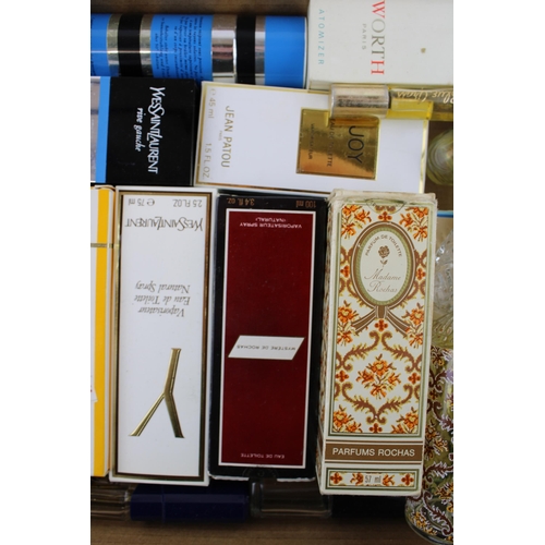 140 - A large collection of designer perfumes & eau de toilette to include Jean Patou Joy, Yves Saint Laur... 