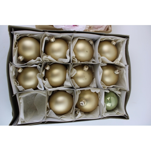 144 - Two boxes of vintage christmas decorations to include glass baubles in pink and silver and later set... 