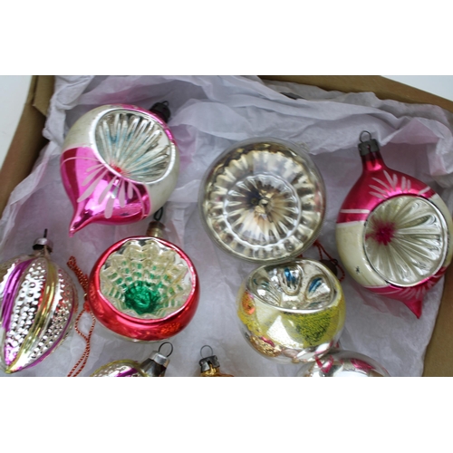 145 - A box of vintage christmas decorations to include mercury glass baubles.