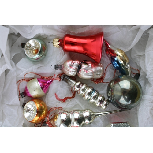 146 - A box of vintage christmas decorations to include mercury glass baubles.