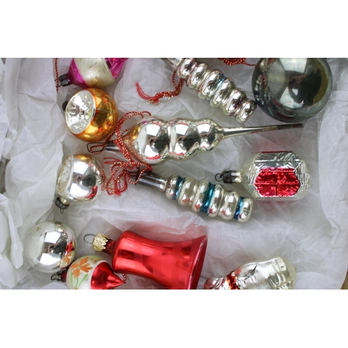 146 - A box of vintage christmas decorations to include mercury glass baubles.