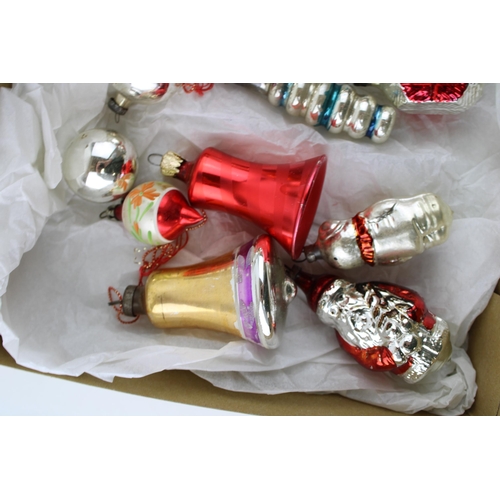 146 - A box of vintage christmas decorations to include mercury glass baubles.