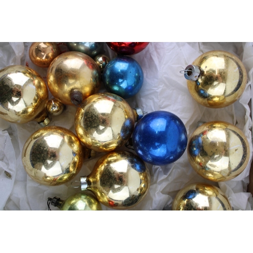 147 - A box of vintage christmas decorations to include glass baubles.