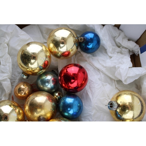 147 - A box of vintage christmas decorations to include glass baubles.