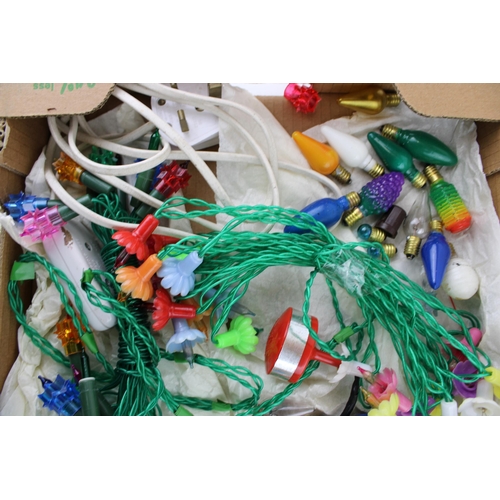 149 - A box of vintage Christmas decorations to include vintage lights and special light bulbs.