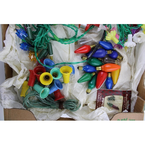 149 - A box of vintage Christmas decorations to include vintage lights and special light bulbs.